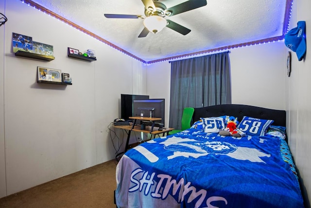 carpeted bedroom with a textured ceiling and ceiling fan