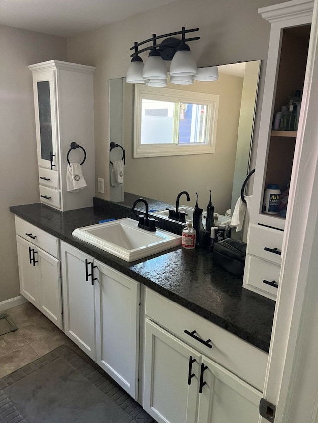 bathroom with vanity and tile patterned flooring