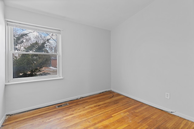 spare room with light hardwood / wood-style floors