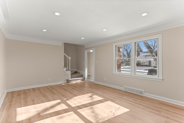 interior space featuring crown molding and light hardwood / wood-style flooring