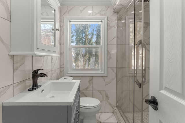 bathroom featuring vanity, ornamental molding, and toilet