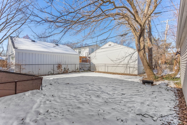 view of yard layered in snow