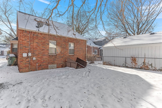 view of snow covered house