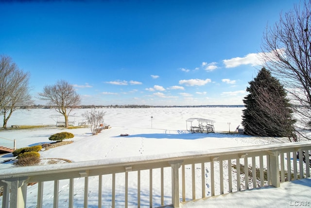 snow covered deck with a trampoline