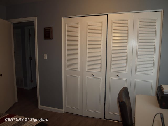 unfurnished office featuring dark hardwood / wood-style flooring