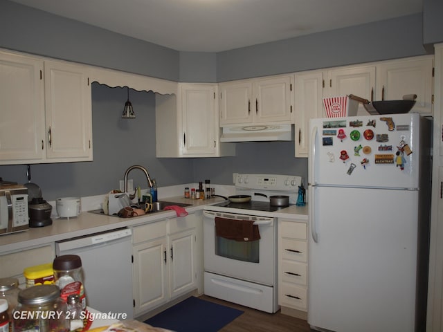 kitchen with dark hardwood / wood-style floors, white cabinetry, sink, and white appliances