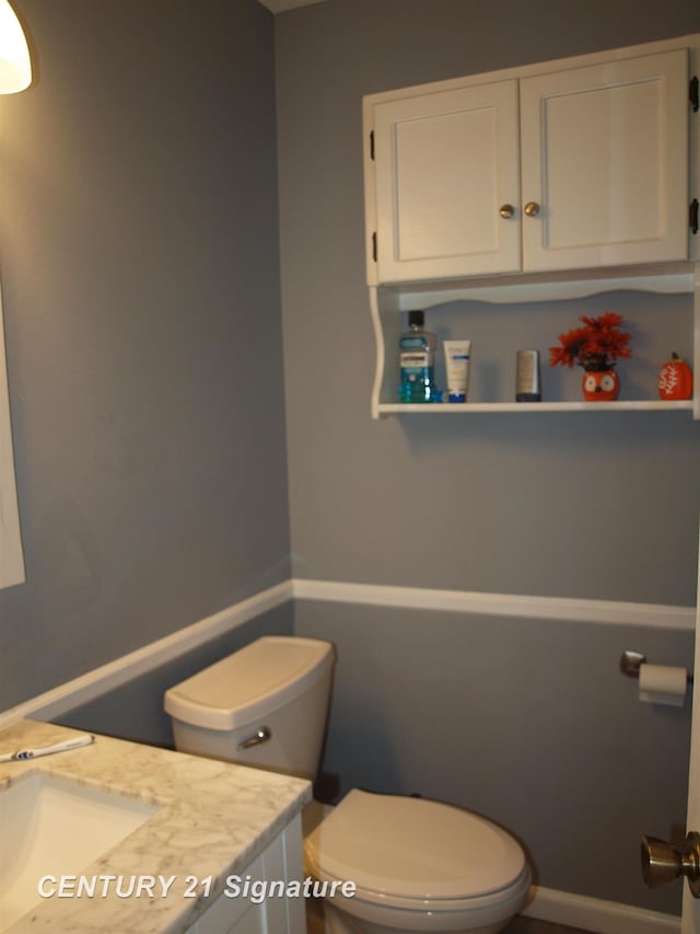 bathroom with vanity and toilet