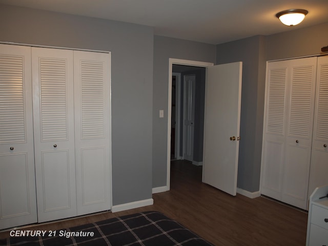 unfurnished bedroom featuring dark hardwood / wood-style floors