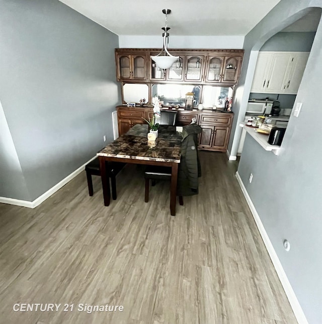 dining room with hardwood / wood-style flooring