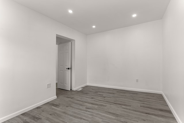 empty room featuring wood-type flooring