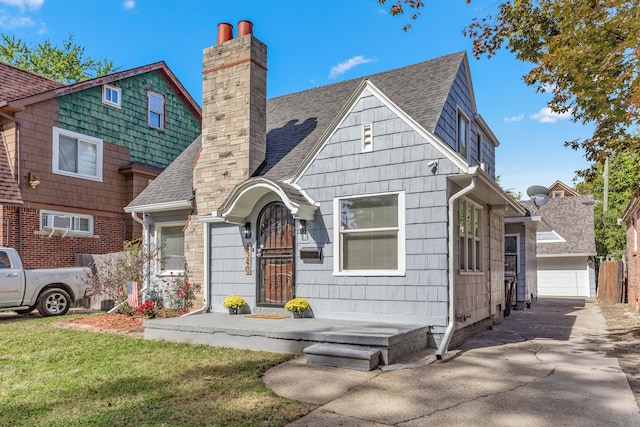 view of front of property with a garage and a front lawn