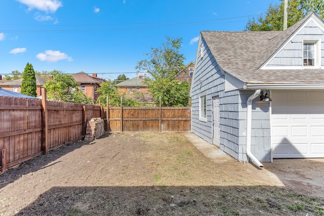 view of yard featuring a garage