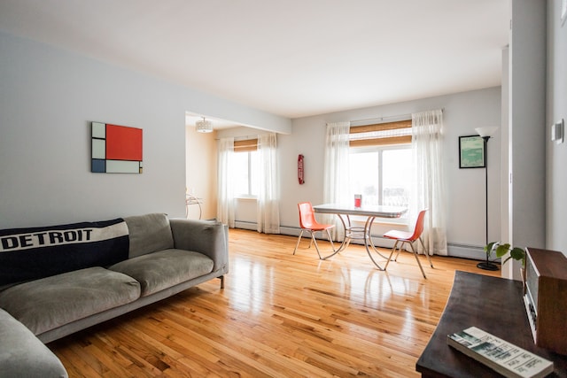 living room featuring light hardwood / wood-style floors and a healthy amount of sunlight