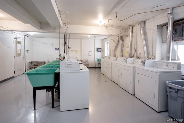 laundry room with sink and washing machine and dryer