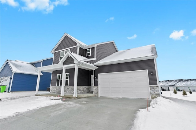 craftsman-style house featuring a garage and covered porch