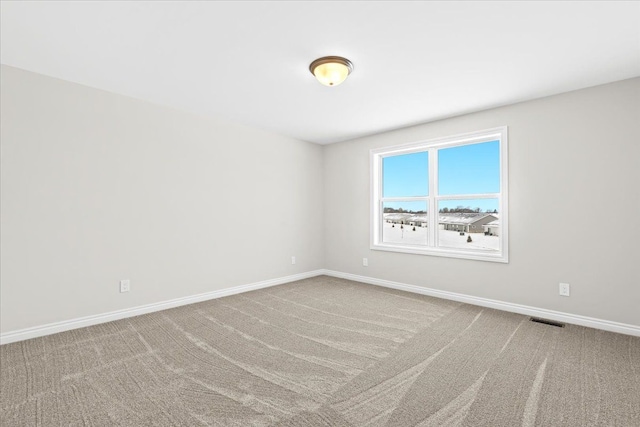 empty room featuring carpet floors