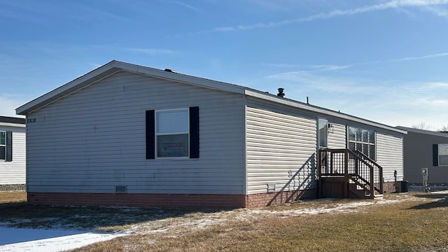 exterior space with a yard and central AC unit