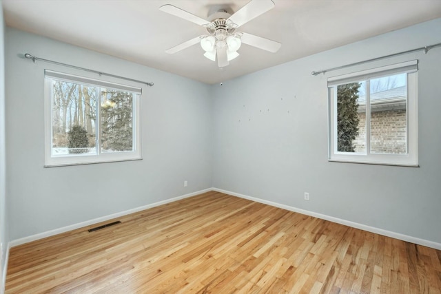 spare room featuring ceiling fan and light hardwood / wood-style floors