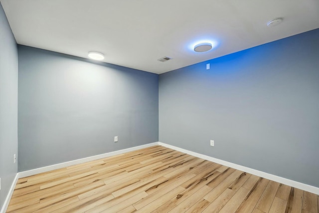 spare room featuring hardwood / wood-style flooring