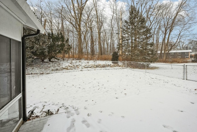 view of yard covered in snow