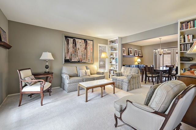 living room with a notable chandelier, built in features, and light colored carpet