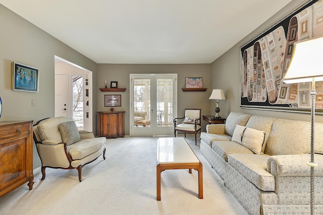 carpeted living room featuring french doors