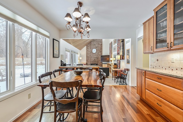 dining space featuring a chandelier and light wood-type flooring