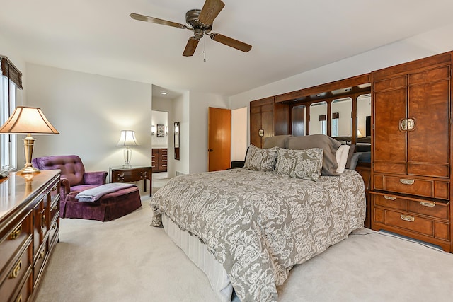 bedroom with light carpet and ceiling fan