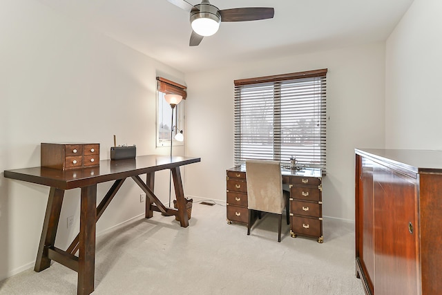 carpeted office with ceiling fan