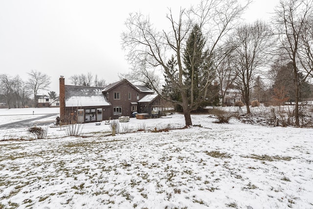 view of yard layered in snow