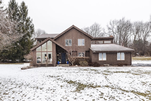 snow covered property featuring french doors