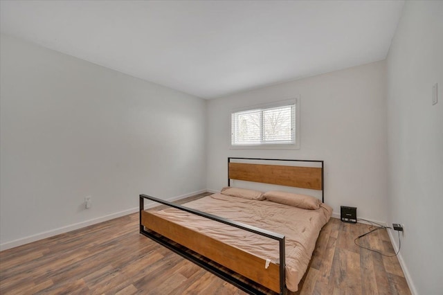 bedroom featuring wood-type flooring