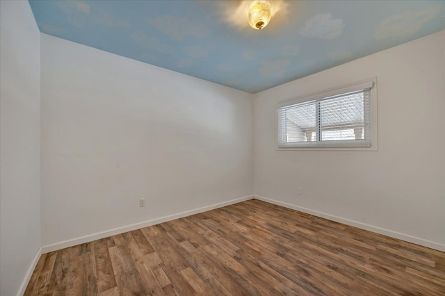 empty room featuring hardwood / wood-style floors