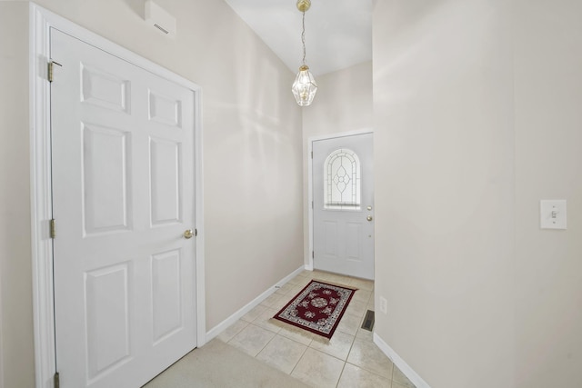 entryway with light tile patterned flooring