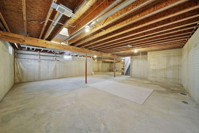 basement with brick wall