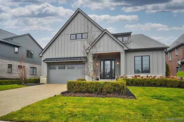 modern farmhouse style home featuring a garage and a front yard