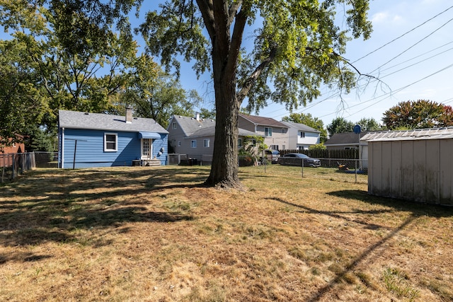 view of yard with a storage unit