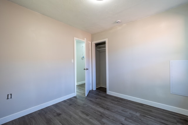 spare room with dark hardwood / wood-style floors