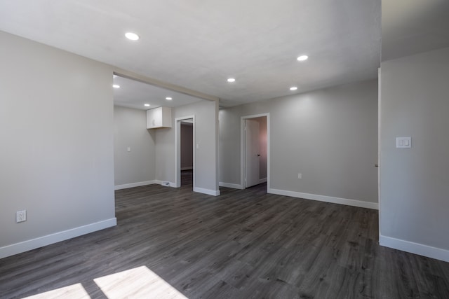 spare room featuring dark hardwood / wood-style floors