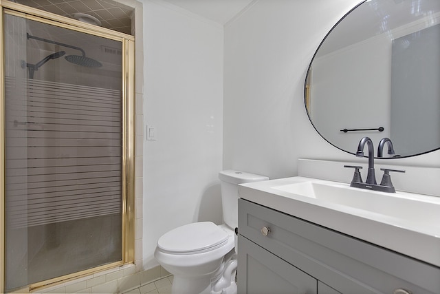 bathroom with tile patterned floors, vanity, toilet, and a shower with door