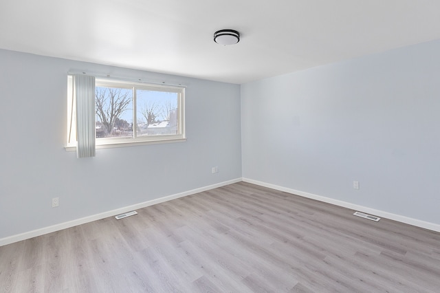 empty room featuring light hardwood / wood-style floors