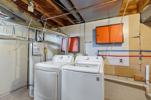 washroom featuring independent washer and dryer and water heater