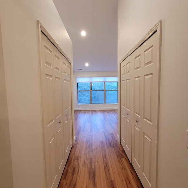 hall with light hardwood / wood-style flooring