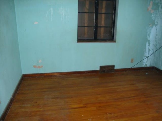 empty room featuring hardwood / wood-style floors