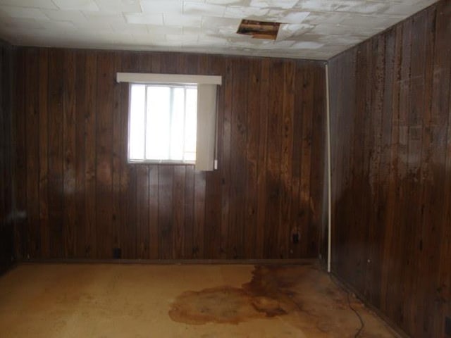 empty room with wood walls