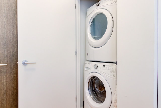 laundry room featuring stacked washer / dryer