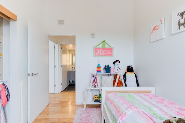 bedroom with light hardwood / wood-style flooring