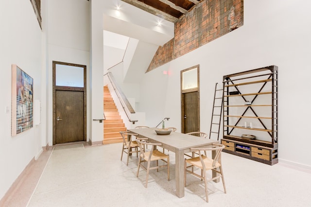 dining space with a high ceiling