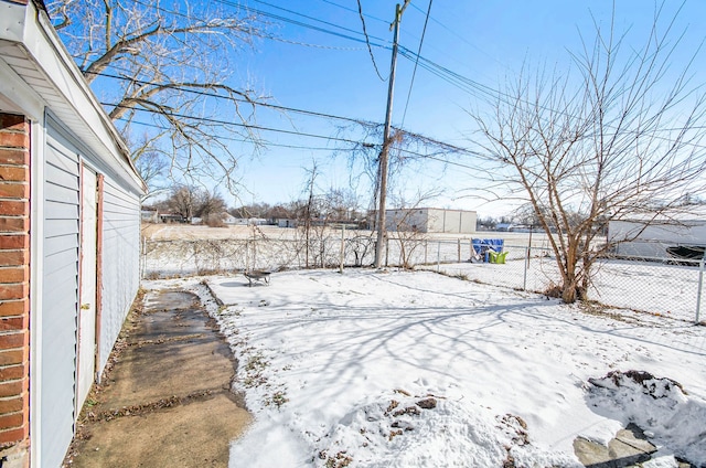 view of yard covered in snow