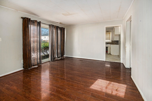 empty room with dark wood-type flooring